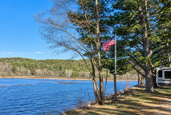 Lakeside campground with American flag