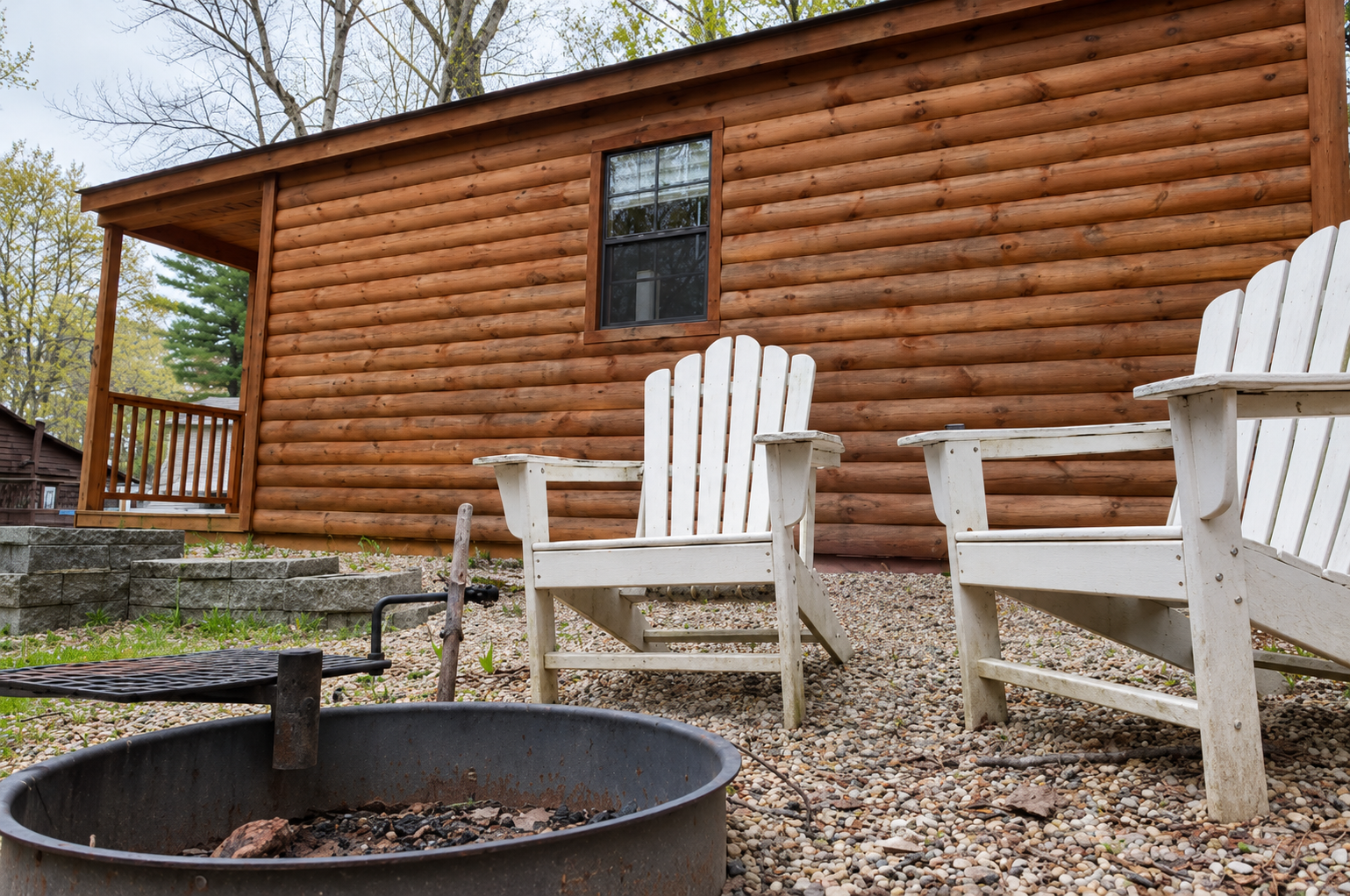 Rustic Cabin Firepit and Adirondack Chairs